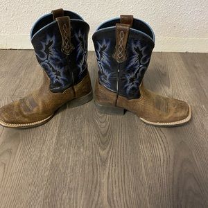 Boys Ariat cowboy boots.
